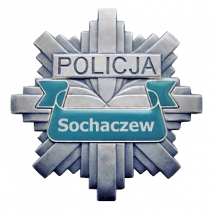 Logo Policji w kształcie gwiazdy. Logo jest koloru srebrnego. Na gwieździe jest napis policja i tło koloru morskiego na którym umieszczono napis Sochaczew
